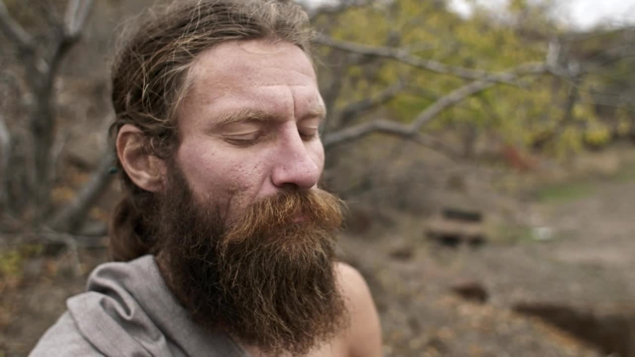 Stock Video Bearded Man Meditates With Closed Eyes In Nature Live Wallpaper For PC - Free Download