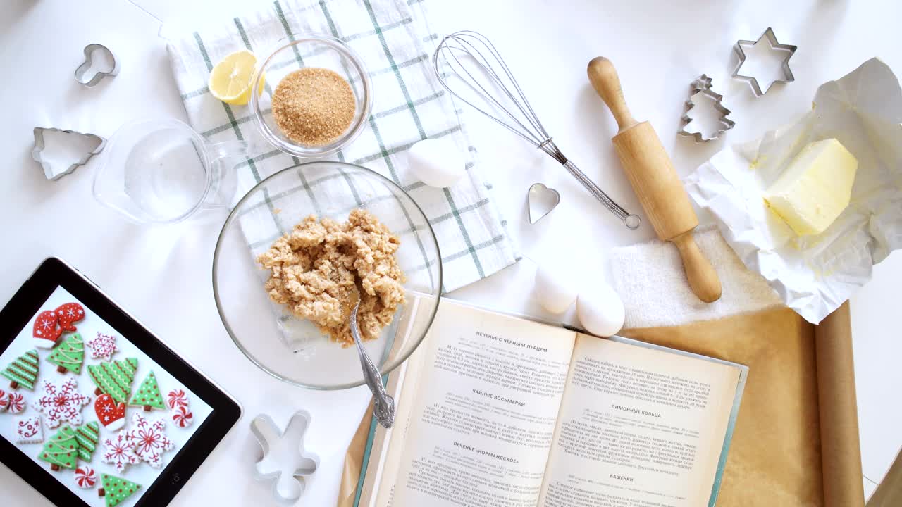 Free Video Stock top view of woman making cookies from recipe on tablet Live Wallpaper - Free Download