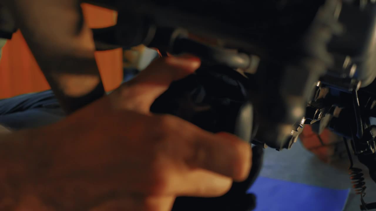 Stock Video Mechanic Maintaining A Motorcycle Engin Animated Wallpaper - Free Download