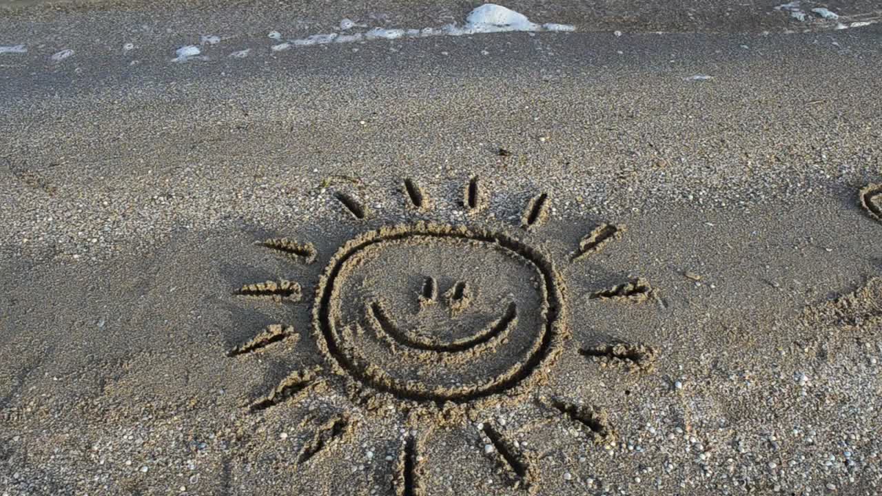 Free Video Stock Smiling Sun Drawn In The Sand On A Beach Live Wallpaper - Free Download