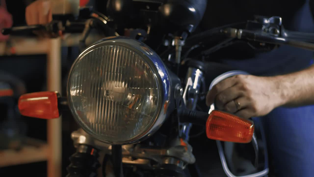 Stock Video Headlight Of A Motorcycle That Is Turned On By A Animated Wallpaper - Free Download