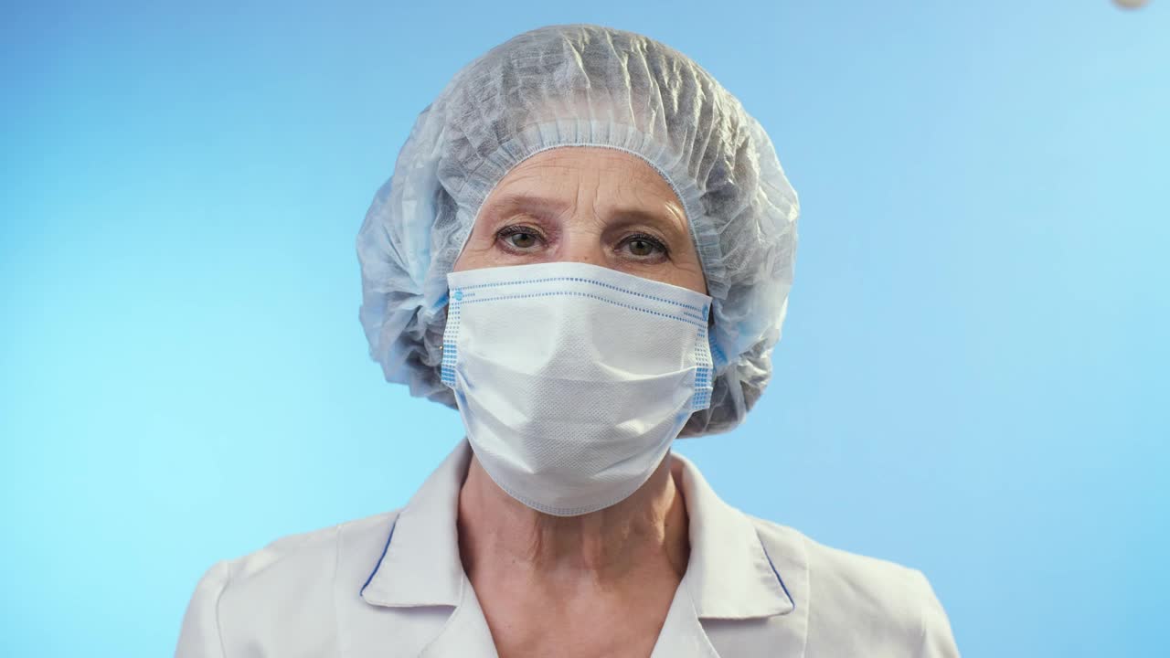 Video Stock Portrait Of An Adult Female Doctor On Blue Live Wallpaper Free - Free Download