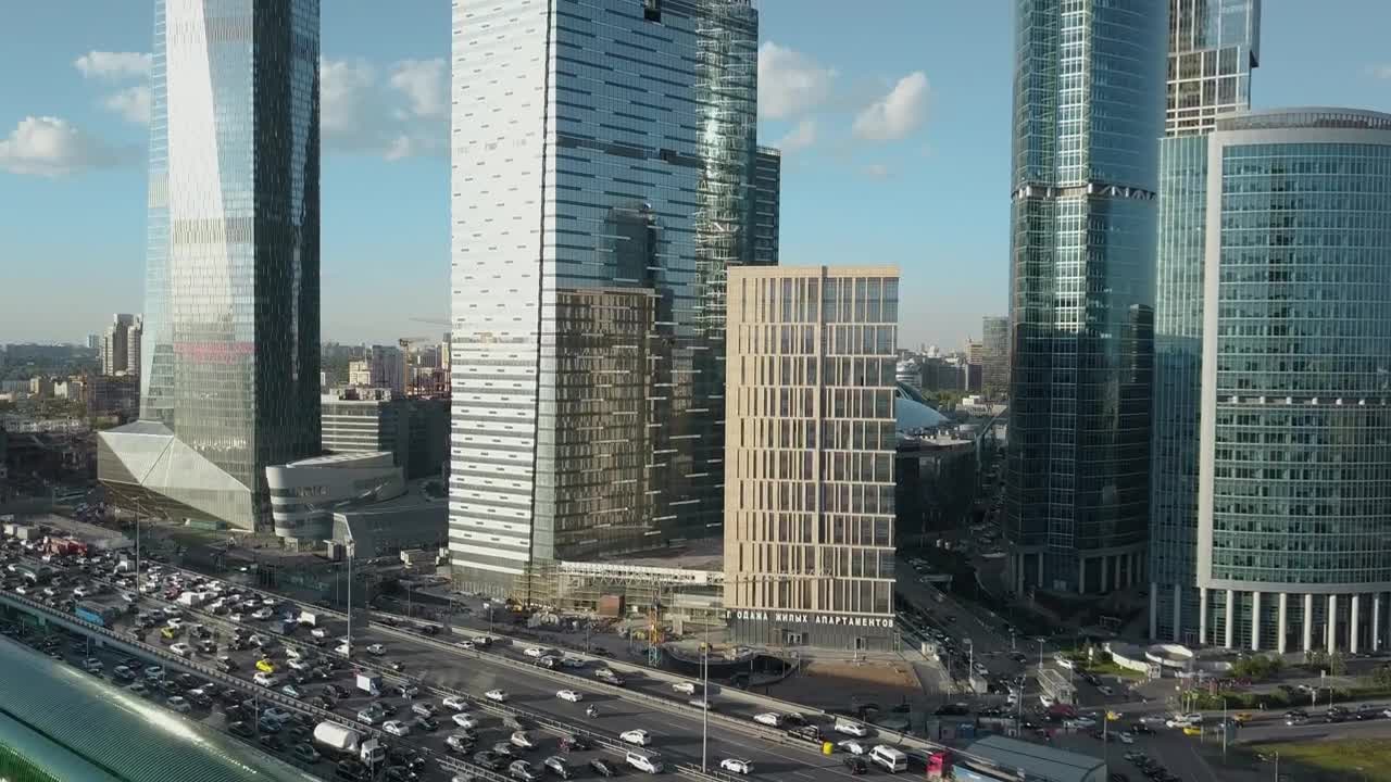 Stock Video Heavy Traffic Heading By Skyscrapers Animated Wallpaper - Free Download