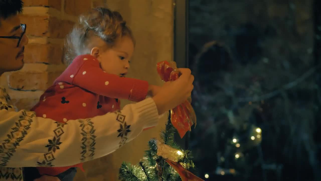 Stock Video Parents And Daughter Putting A Bow On The Top Of Live Wallpaper - Free Download