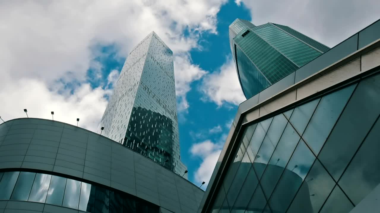 Stock Video Low View Of Office Buildings With Clouds In The Sky Animated Wallpaper - Free Download