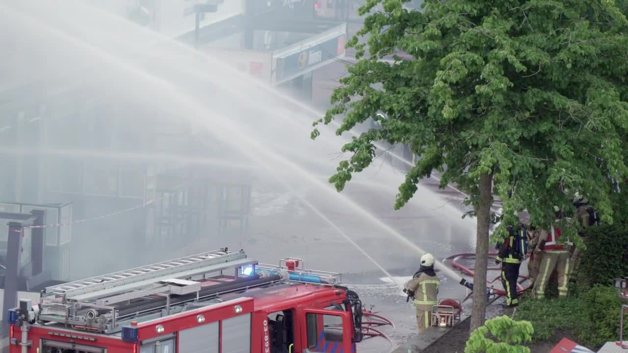 Stock Video Firefighters On The Street Shooting Water With Their Hoses Live Wallpaper For PC - Free Download
