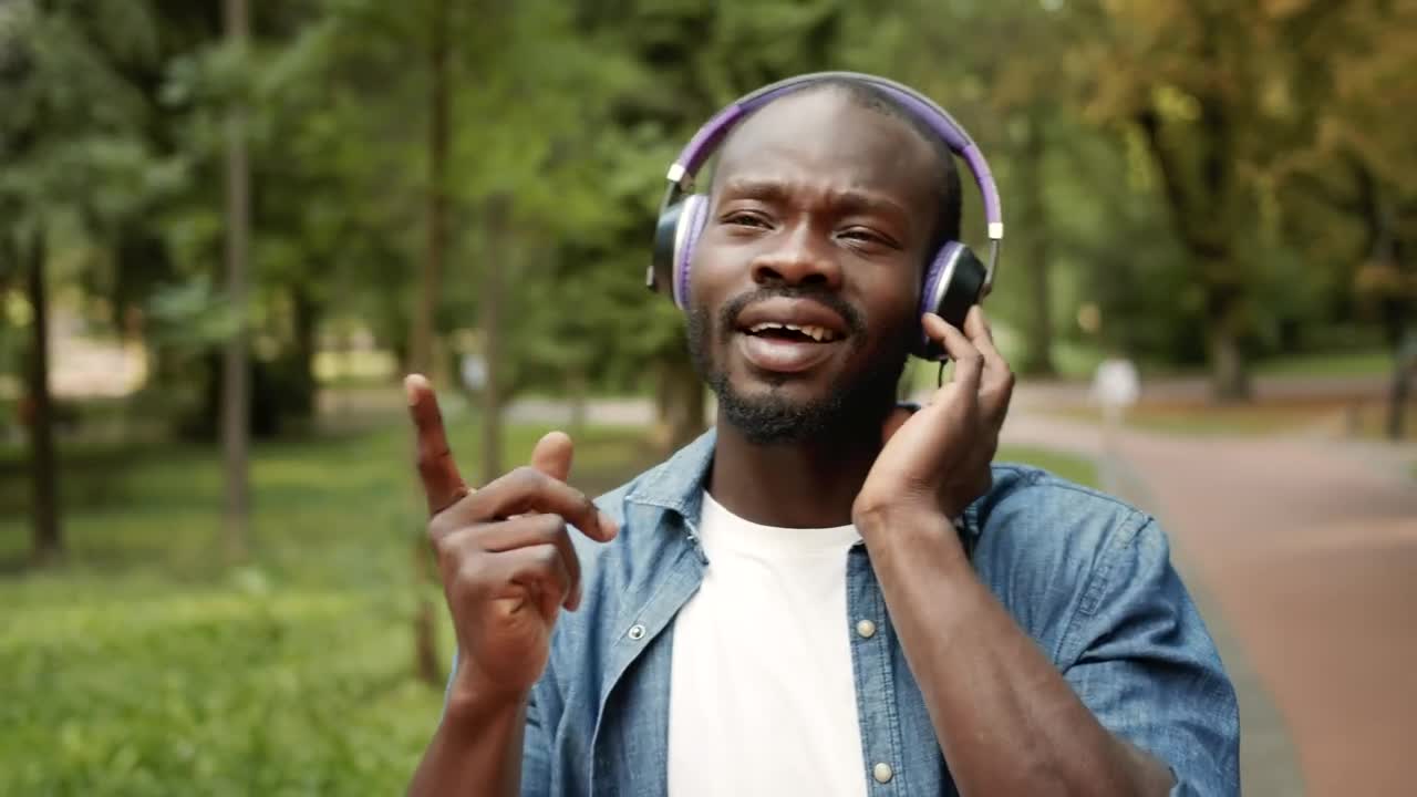 Stock Video Man Inspired By Music In Headphones Sings Alon Animated Wallpaper - Free Download