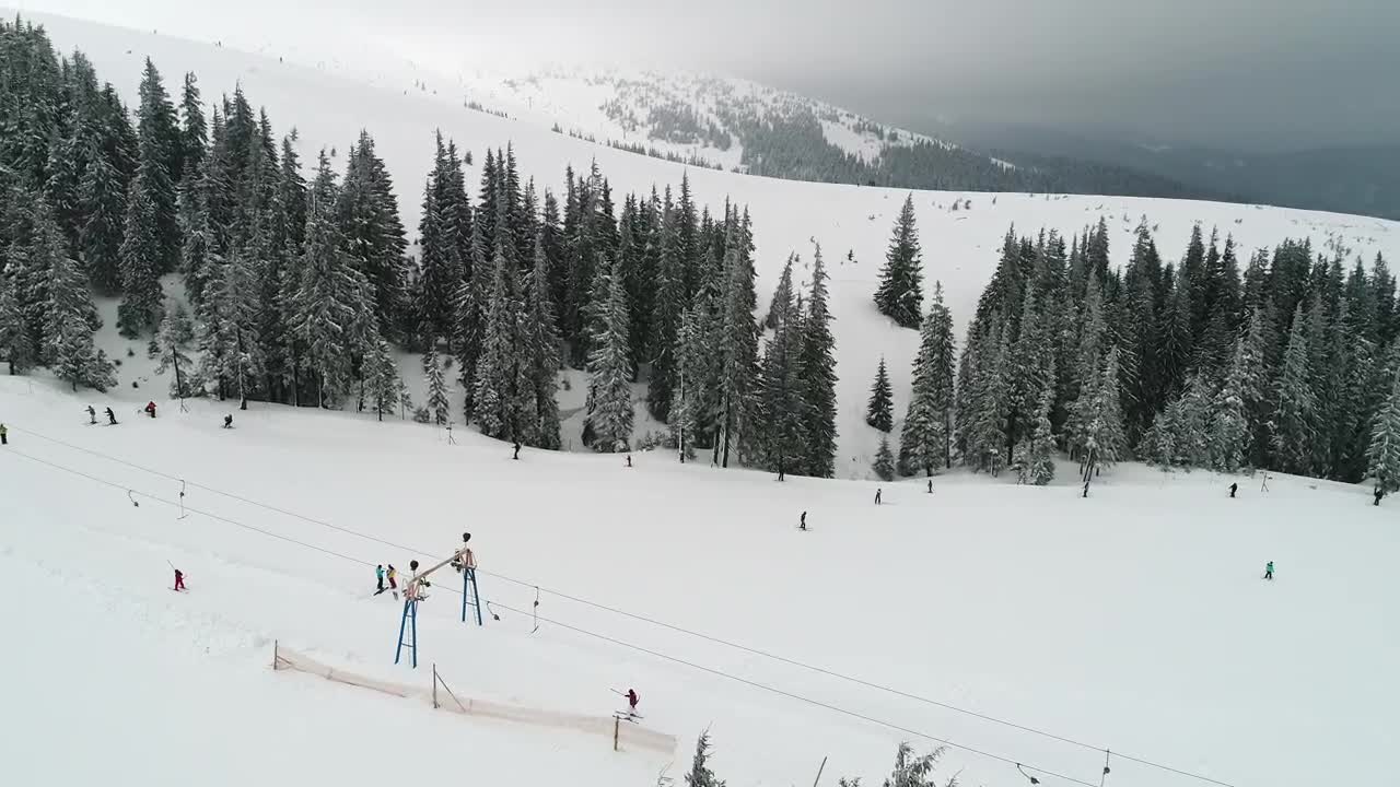 Stock Video Flying Over Mountains Slope With Skiers Live Wallpaper For PC - Free Download