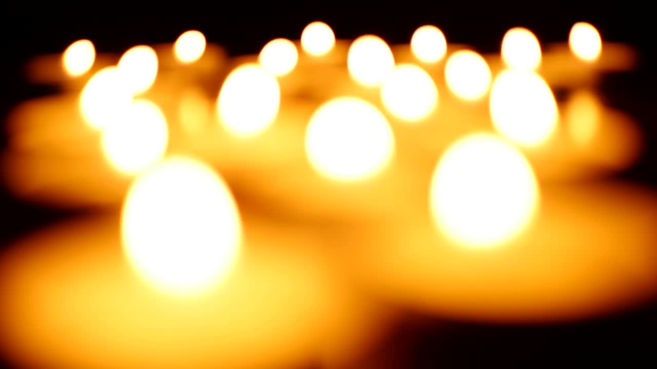 Video Stock Candles Lighting Up In The Dark Out Of Focus Live Wallpaper For PC - Free Download