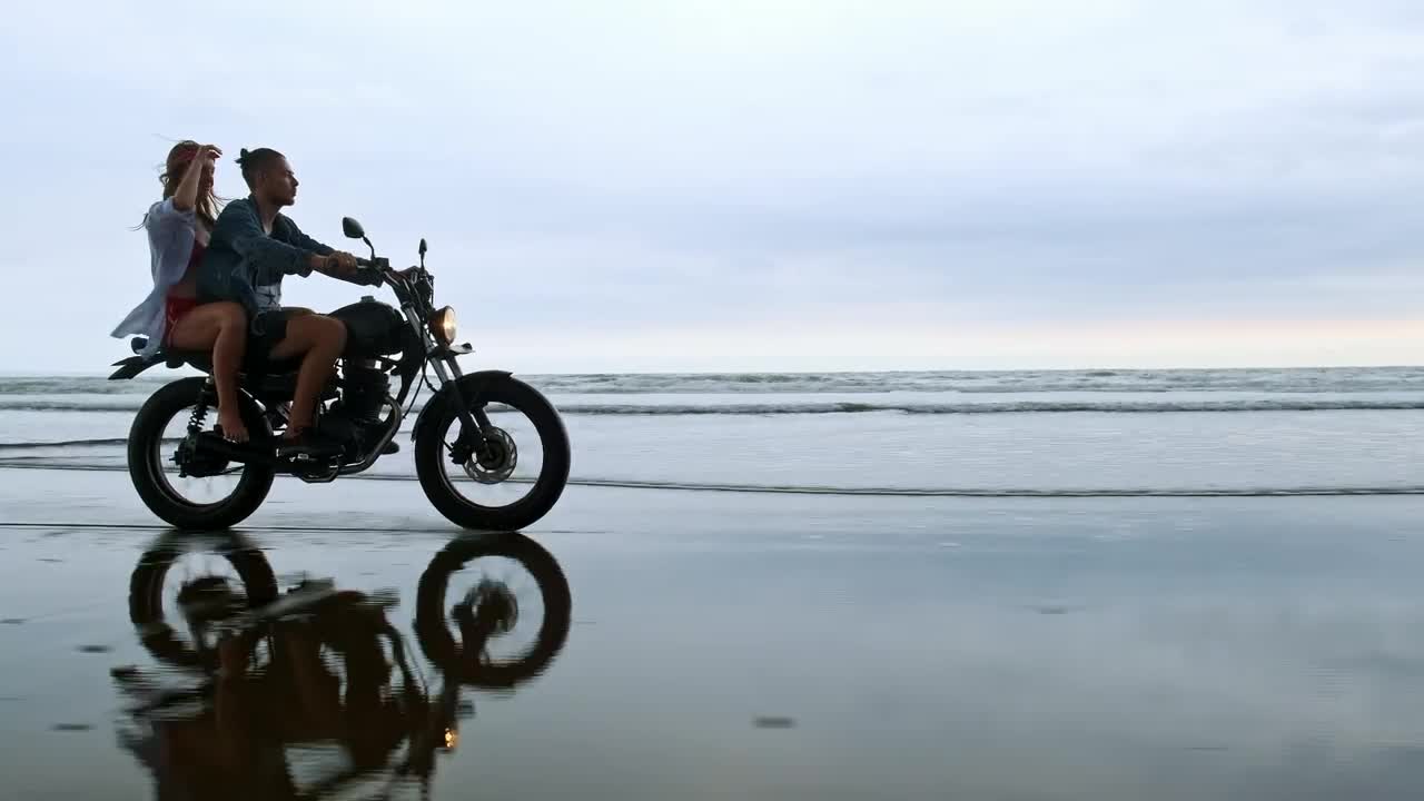 Stock Video Couple Enjoying A Motorcycle Trip On Their Beach Vacation Live Wallpaper For PC - Free Download