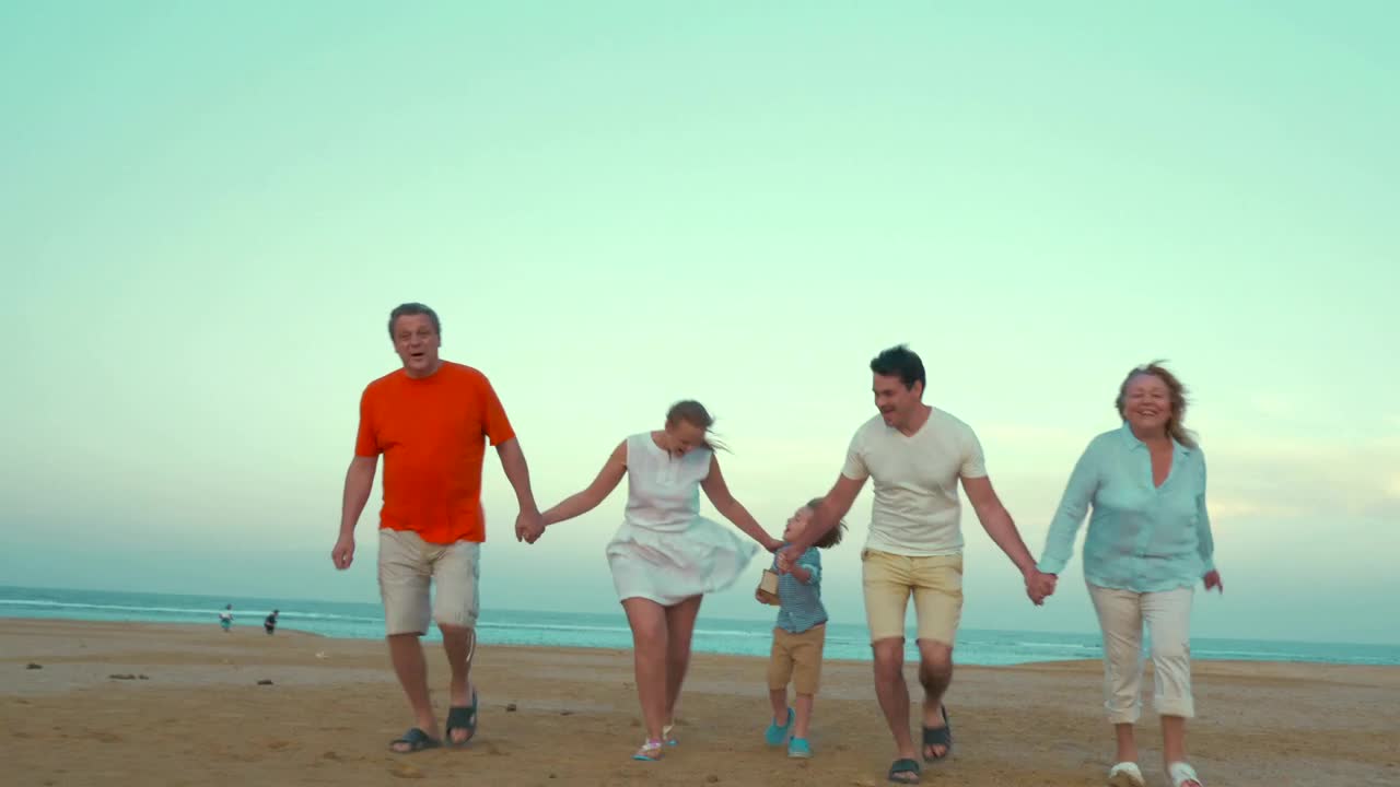 Stock Video Family Holding Hands At The Beach Live Wallpaper For PC - Free Download
