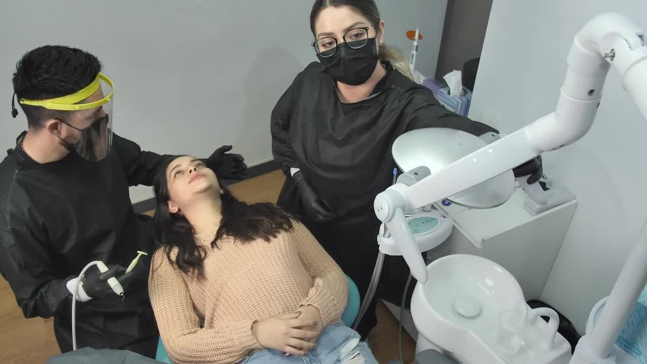 Stock Video Dentist And His Assistant Working With A Patient Live Wallpaper For PC - Free Download