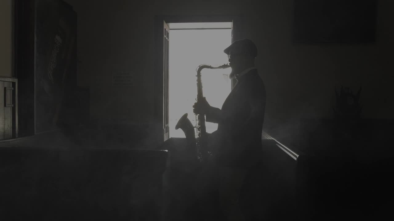Free Stock Video Saxophonist Silhouette Playing Music In A Dark Room Live Wallpaper - Free Download