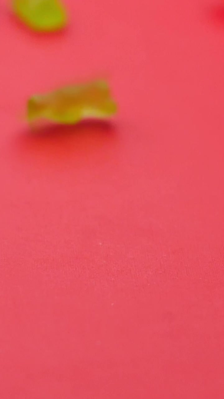 Free Video Stock sweets in the shape of pandas rolling on a pink Live Wallpaper - Free Download