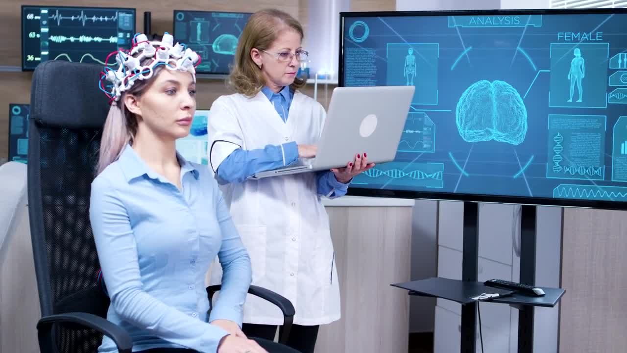 Stock Video Doctor Looks At Patient Brain Scan On Screen Live Wallpaper For PC - Free Download