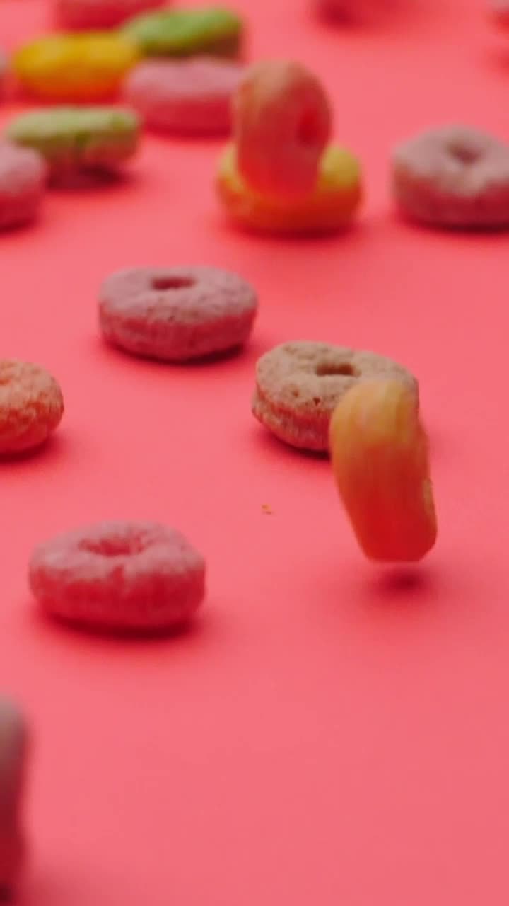Free Video Stock Sugar Ring Cereal Gliding Across A Pink Surface Live Wallpaper - Free Download