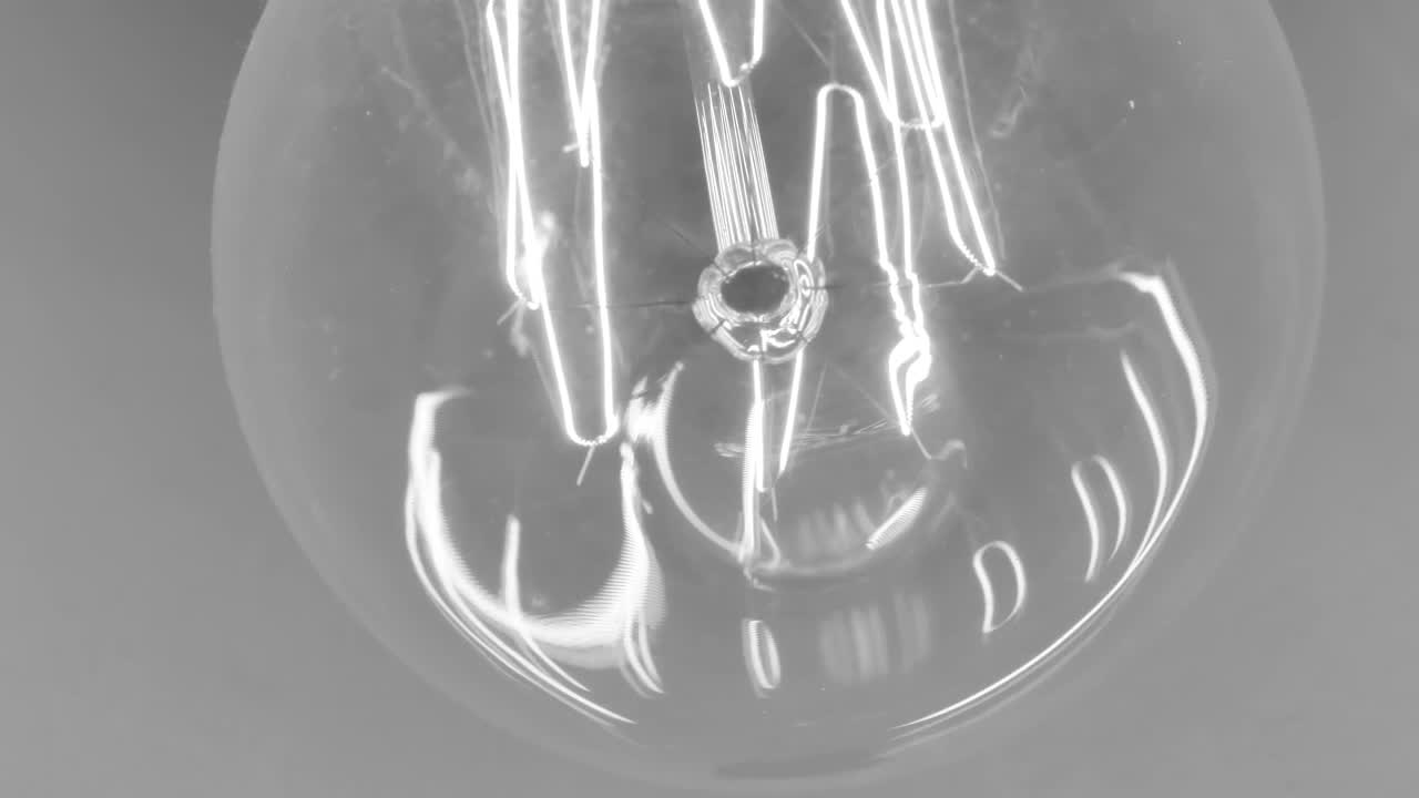 Stock Video Lit Filament Reflected In A Light Bulb Animated Wallpaper - Free Download