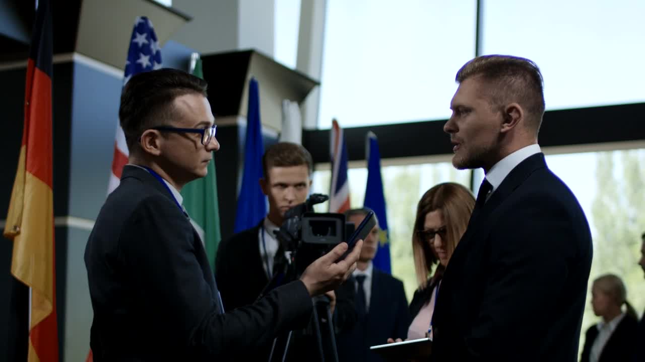 Free Video Stock the politician being interviewed by a journalist Live Wallpaper - Free Download