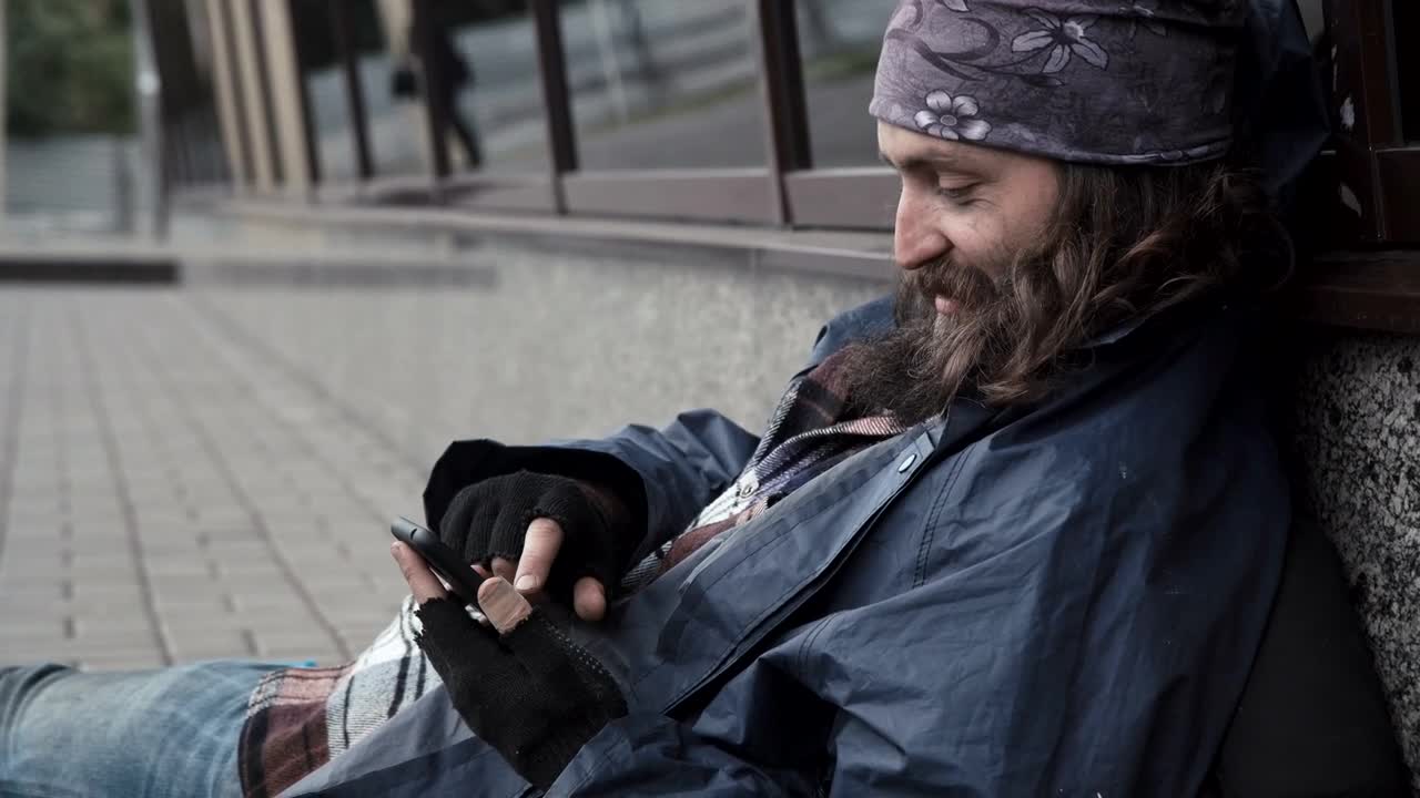 Stock Video Homeless Man Scrolling On His Phone Animated Wallpaper - Free Download