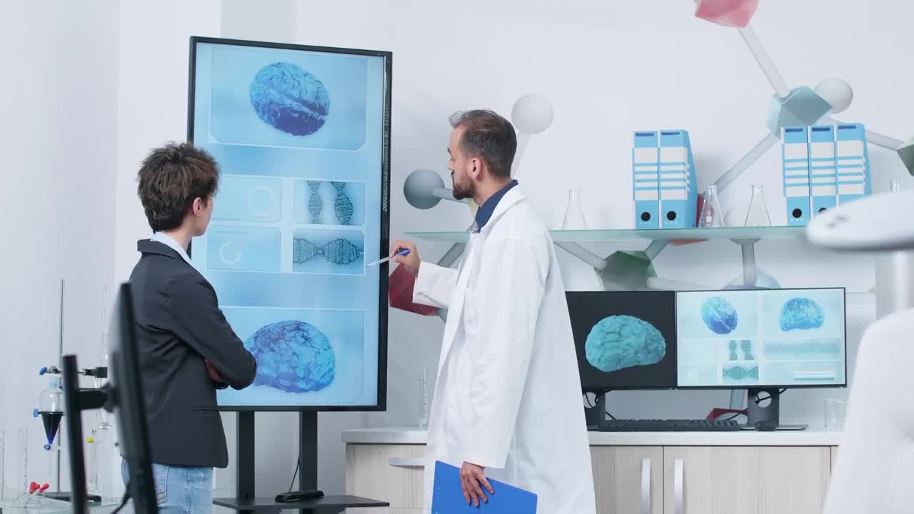 Stock Video Doctor And Scientist Look At D Brain Models In Modern Live Wallpaper For PC - Free Download