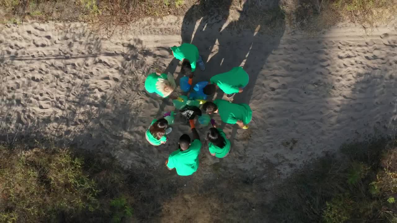 Stock Footage Volunteer Team Waving At A Drone Live Wallpaper - Free Download
