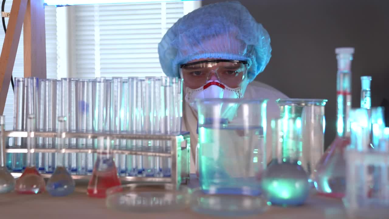 Free Stock Video Scientist Mixing Components On Flasks Live Wallpaper - Free Download