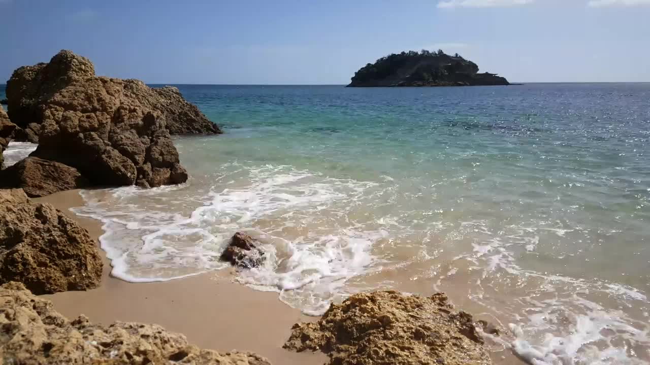Stock Video Beach With Rocks And An Island In The Background Live Wallpaper For PC - Free Download