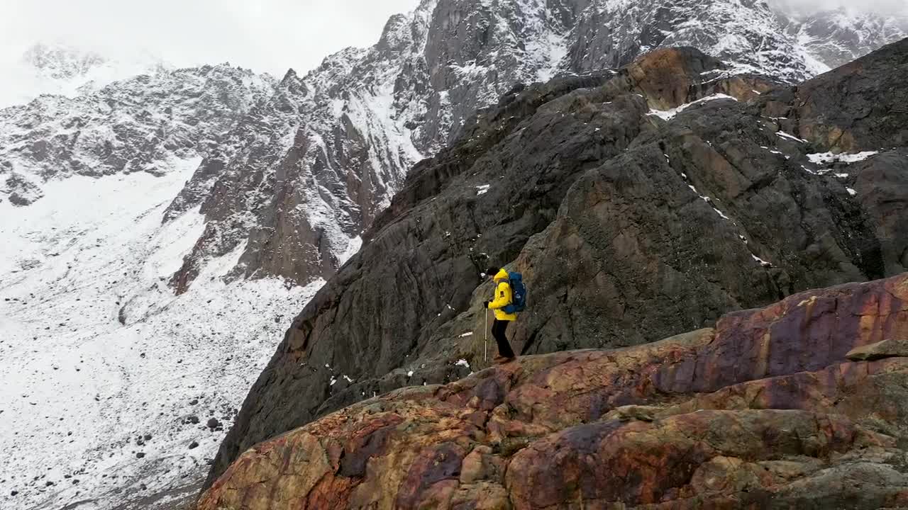 Stock Video Explorer Walking On Top Of A Mountain Live Wallpaper For PC - Free Download