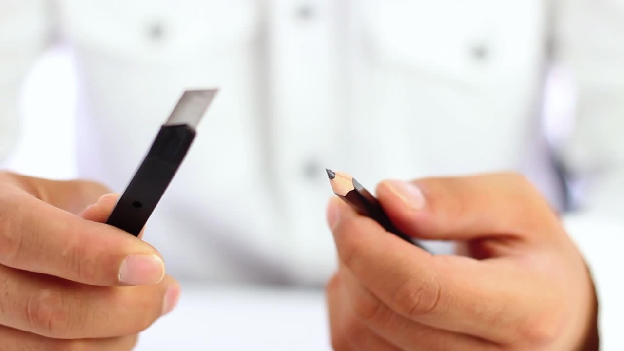Stock Video Man Sharpening A Pencil With A Cutte Animated Wallpaper - Free Download