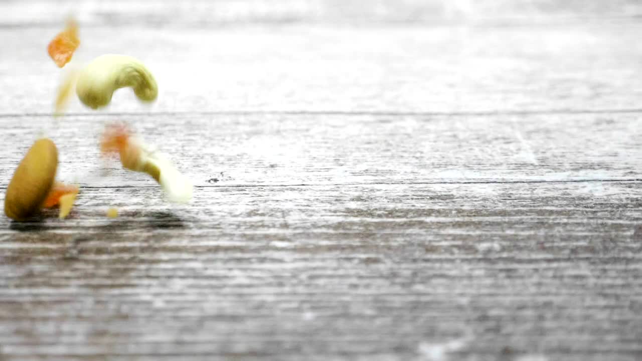 Stock Video Mixed Nuts Falling Onto A Tabl Animated Wallpaper - Free Download