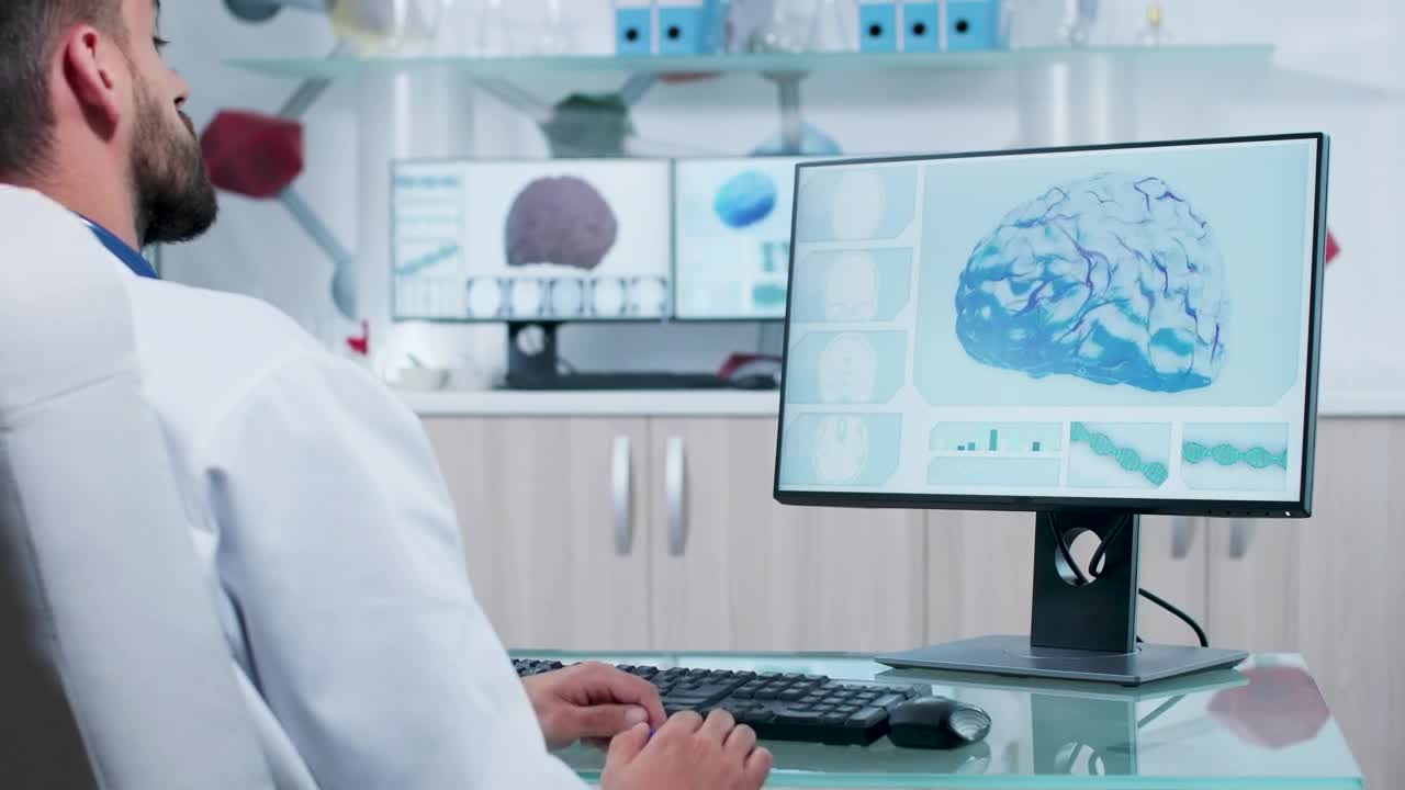 Free Stock Video Scientist Looks At D Brain Model On Computer Screen Live Wallpaper - Free Download