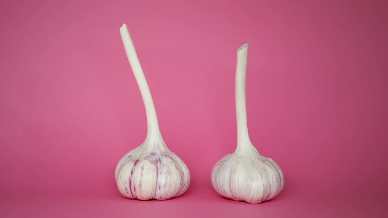 Stock Video Garlic Spinning On A Pink Background Live Wallpaper For PC - Free Download