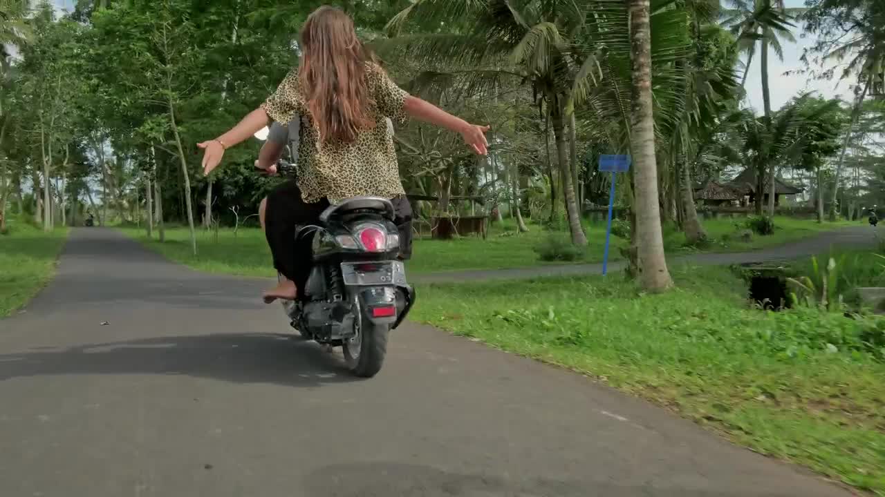 Stock Video Couple Enjoying A Scooter Ride On Their Vacation Live Wallpaper For PC - Free Download
