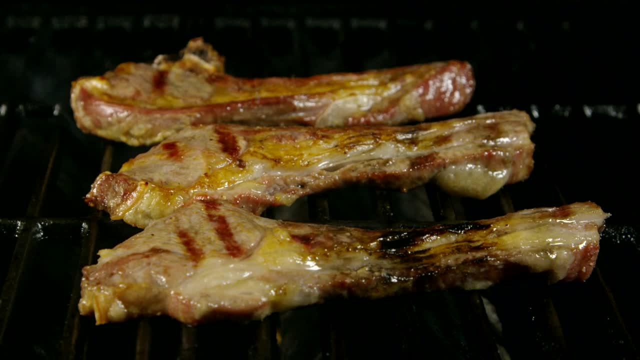 Stock Video Lamb Ribs Cooking On A Grill Animated Wallpaper - Free Download