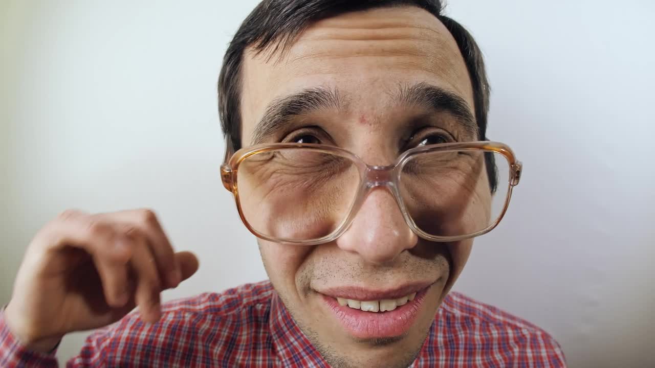 Stock Video Nerd Scratches His Ear Portrait Live Wallpaper - Free Download