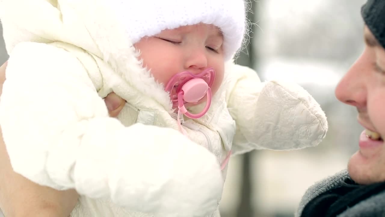 Stock Video Father Looking And Kissing His Baby In Winter Live Wallpaper For PC - Free Download