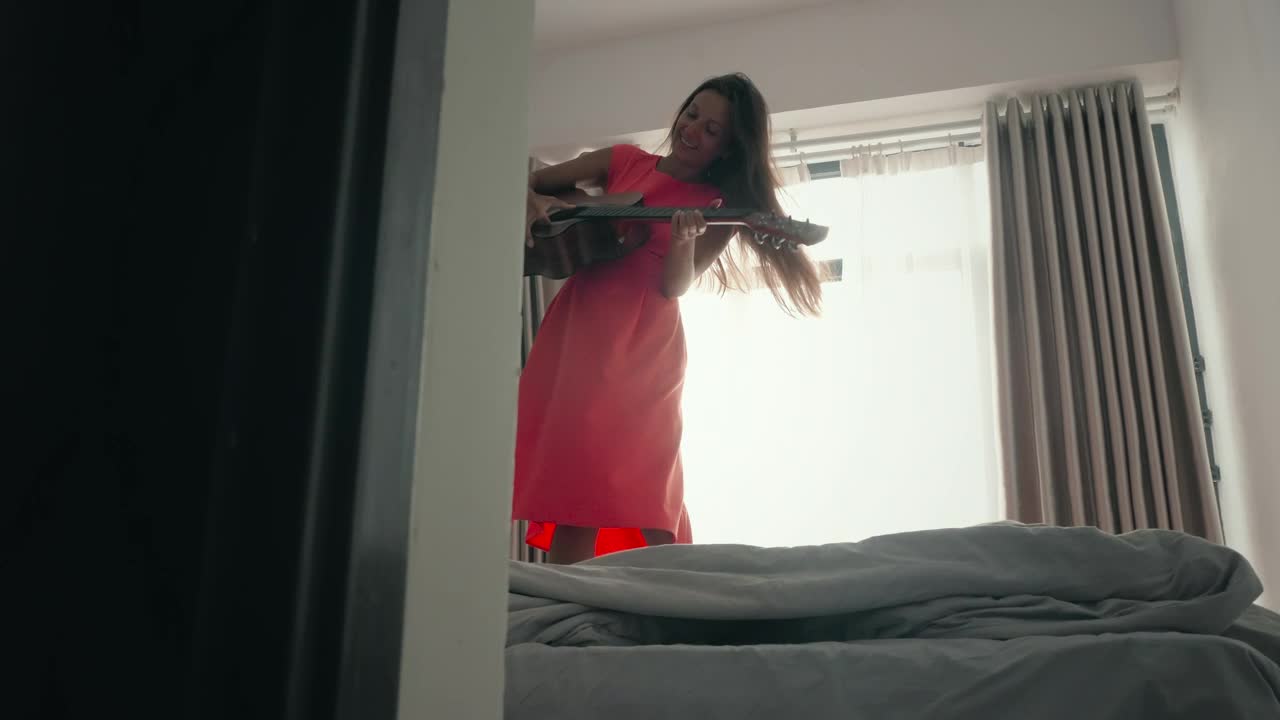 Free Stock Video Woman Dancing On The Bed And Playing The Guitar Live Wallpaper - Free Download