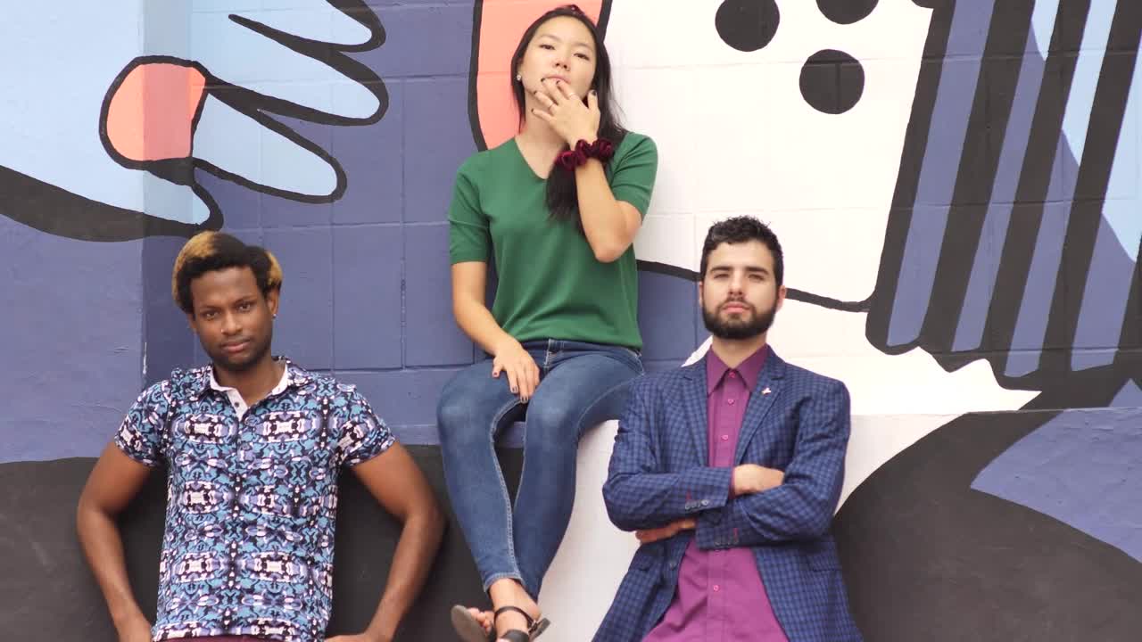 Free Stock Video Two Men And A Woman Looking Serious In Front Of Live Wallpaper - Free Download