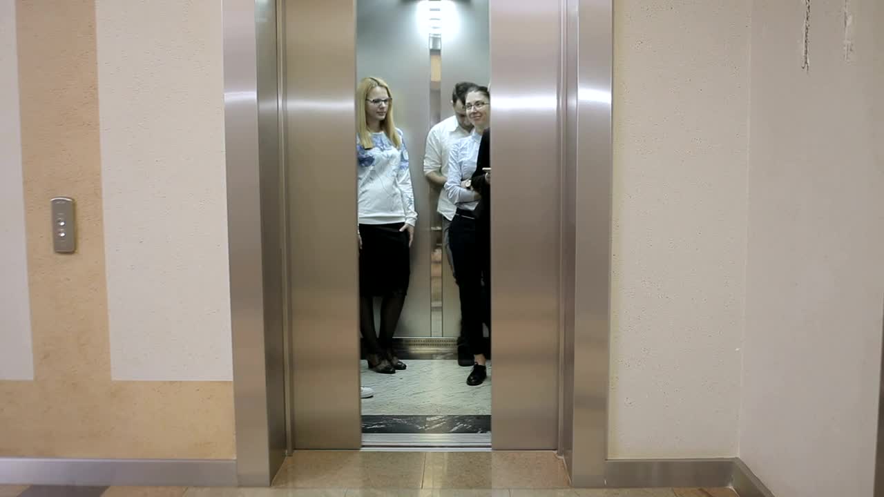 Stock Video Elevator Opens To Reveal Young Business People Live Wallpaper For PC - Free Download