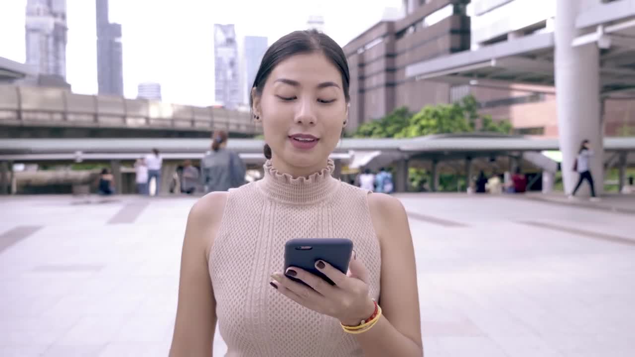Stock Video Happy Woman Reading Messages On Her Cell Phone Animated Wallpaper - Free Download
