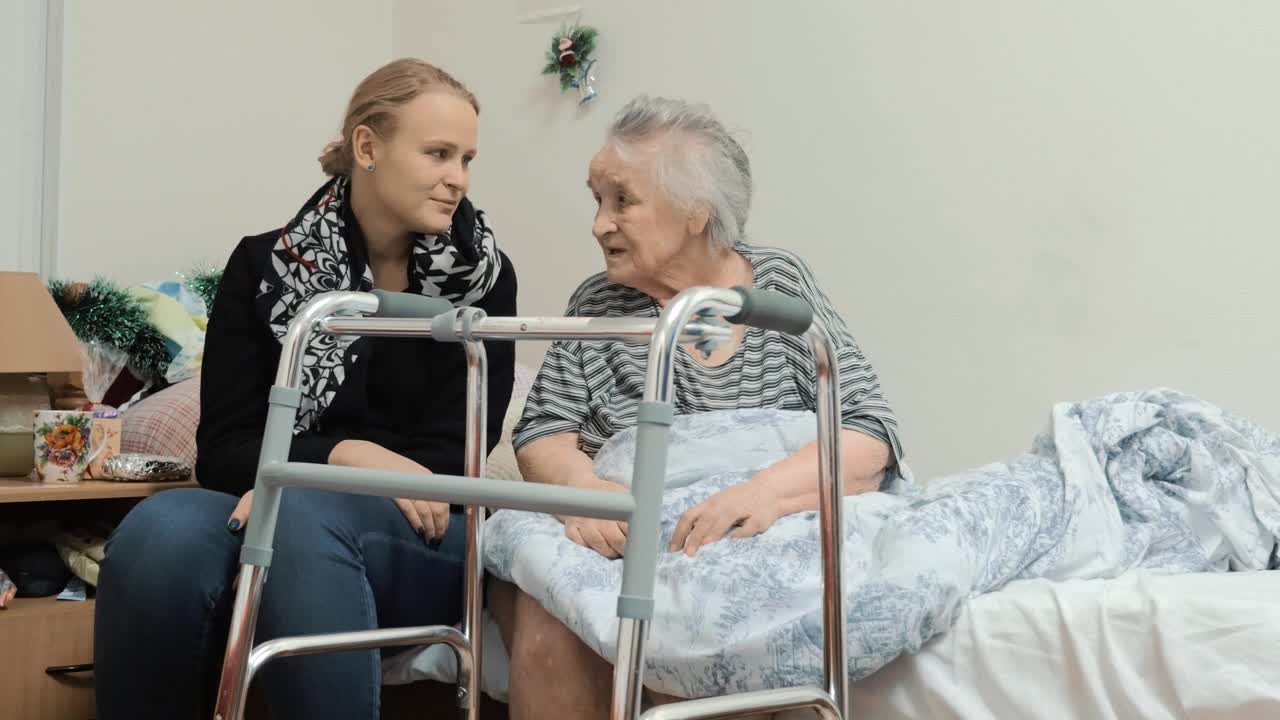 Stock Video Granddaughter Visiting An Elderly Relative Live Wallpaper For PC - Free Download