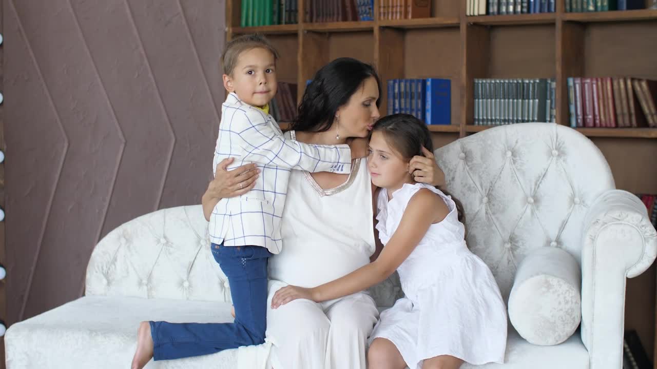 Stock Video Mom Hugs And Kisses Her Daughters Portrai Animated Wallpaper - Free Download