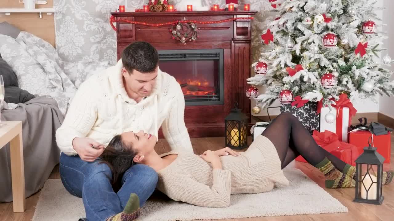 Stock Video Couple Enjoy Christmas Romance In Front Of Fireplace Live Wallpaper For PC - Free Download