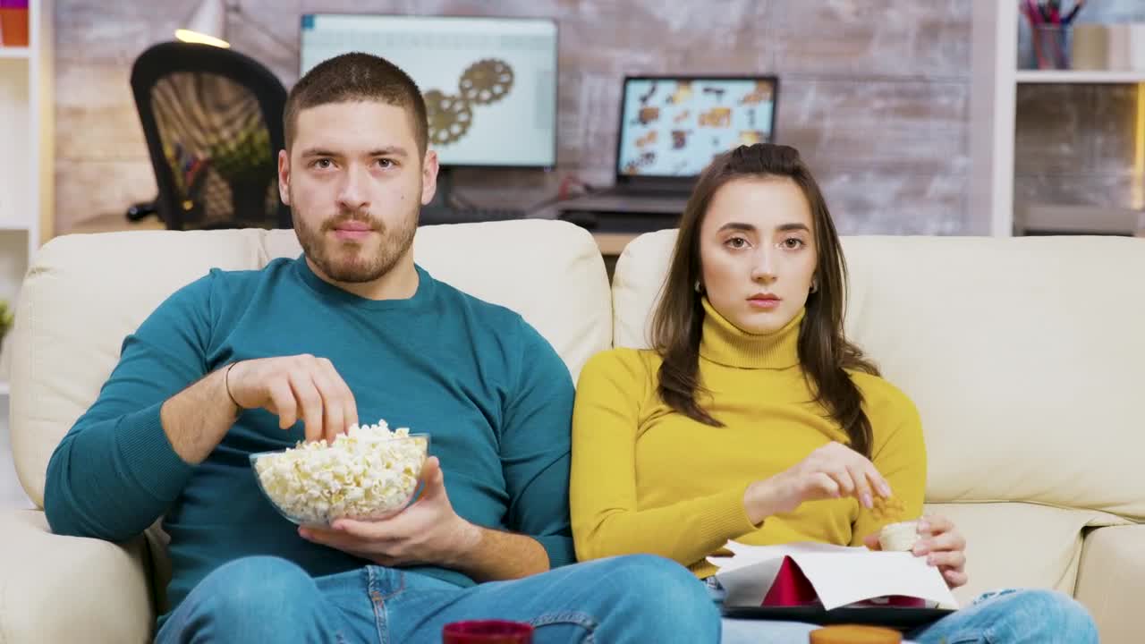 Stock Video Couple Shows Fear While Watching Movie On Sofa Live Wallpaper For PC - Free Download