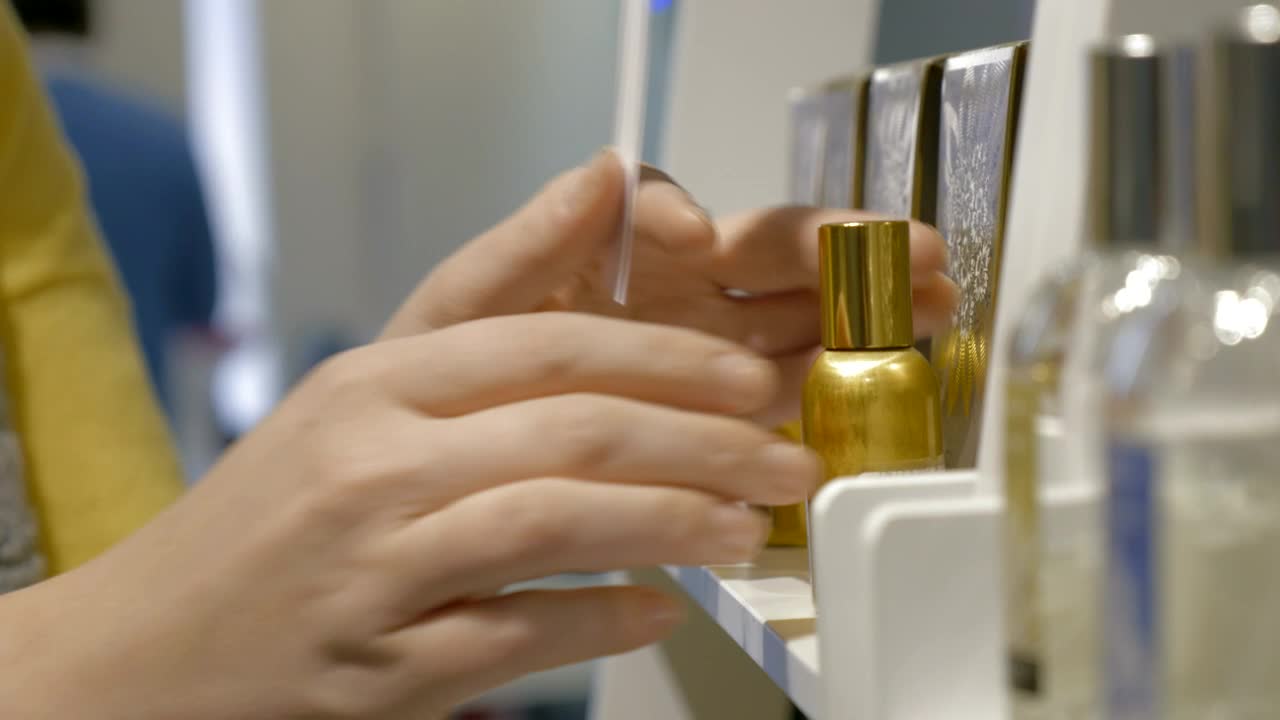 Free Video Stock Spraying A Perfume Sample In A Store Live Wallpaper - Free Download