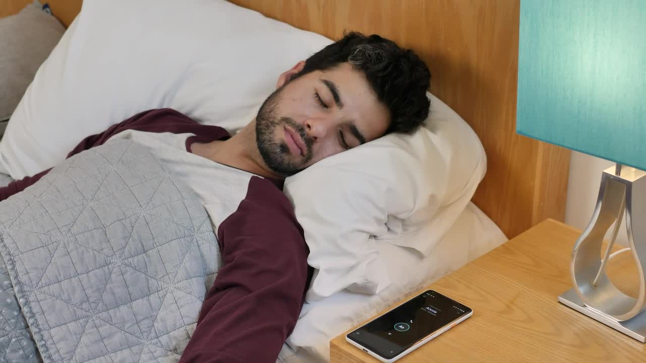 Free Video Stock Sleeping Man Is Awakened By His Cell Phone Alarm Live Wallpaper - Free Download