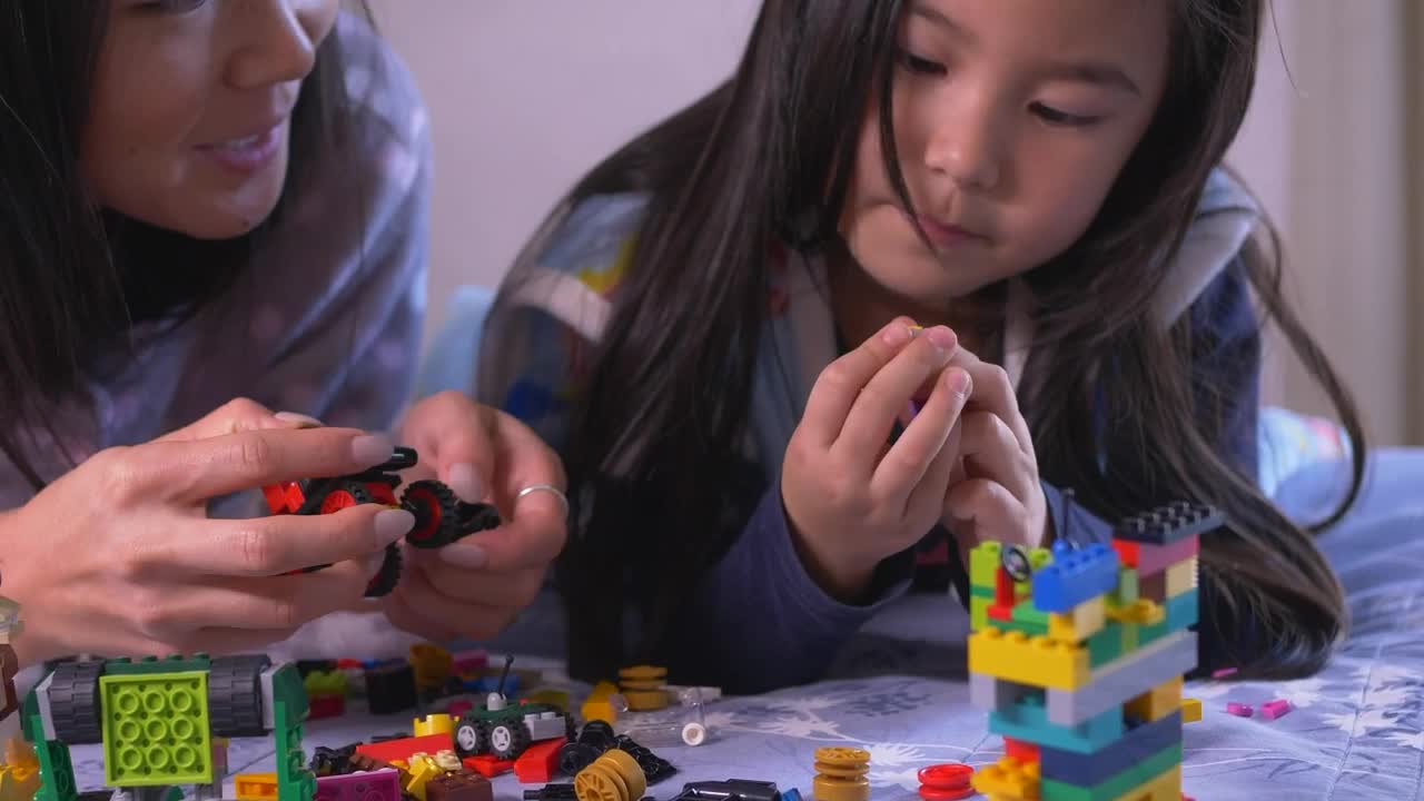 Stock Video Mother And Daughter Playing Together With Lego Animated Wallpaper - Free Download