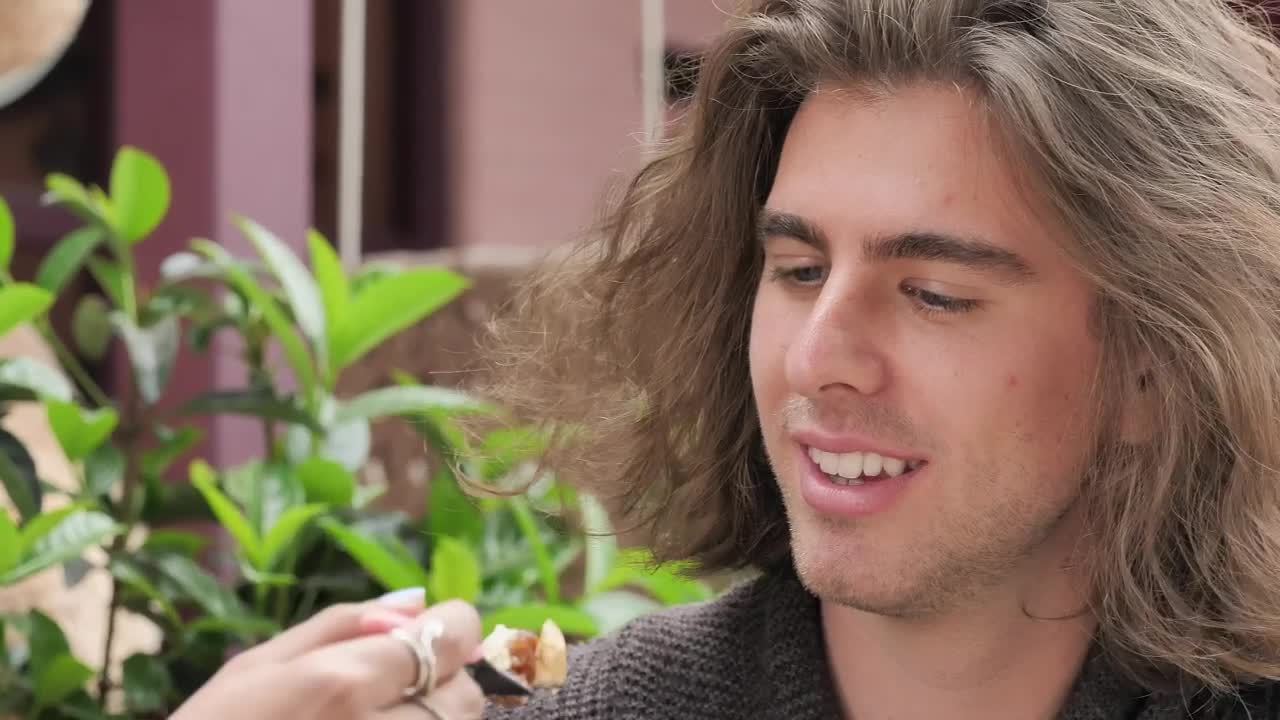 Stock Video Face Of A Man Eating And Joking With His Girlfriend Live Wallpaper For PC - Free Download