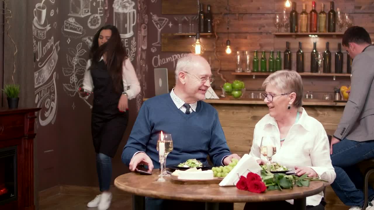 Stock Video Elderly Couple Pay For Dinner With Mobile Phone Live Wallpaper For PC - Free Download