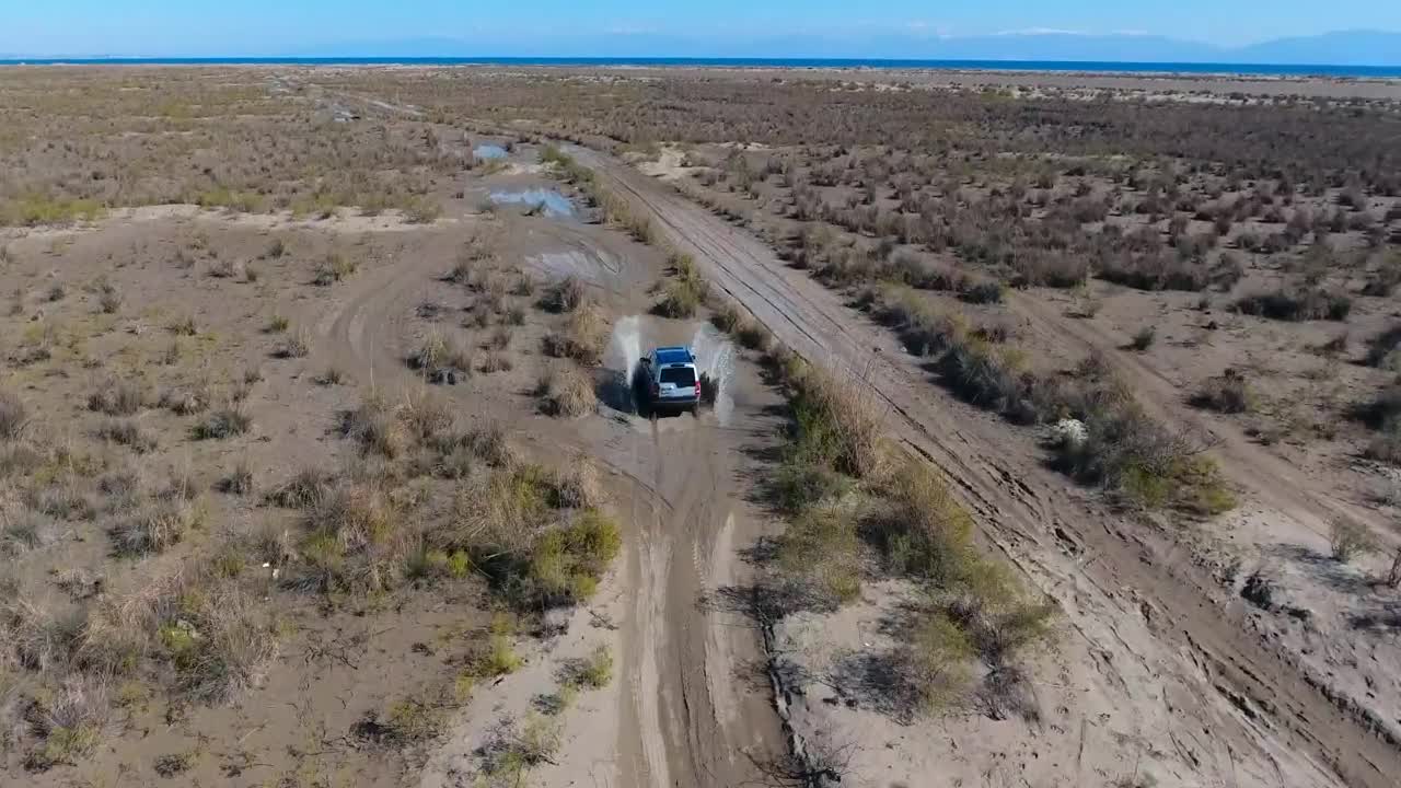 Video Stock Car Passing Through A Puddle In The Plain Live Wallpaper For PC - Free Download